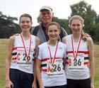 Lincoln Wellington AC winners of the under-17 women, from left to right: Rebekah Ward, Catrina Thomas and Abbie Donnelly with their coach Rob Lewis, ERRA Natioanl Athletes Road Relay.